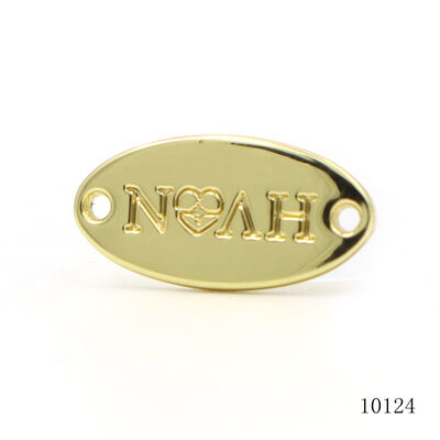 Custom Embossed Oval Two-Hole Metal Logo Tag | Gold Plated Garment & Leather Hardware